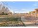 Mature landscaping, stone walkway and covered patio make this backyard the perfect outdoor space at 103 Red Wing Ct, Mead, CO 80542
