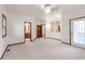 Large bedroom features a walk-in closet, exterior access, and private bath at 103 Red Wing Ct, Mead, CO 80542