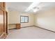 Spacious bedroom featuring neutral paint, carpeted floors, a ceiling fan, and a built-in desk at 103 Red Wing Ct, Mead, CO 80542