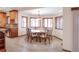 Cozy dining room featuring a round table, six chairs, and bright natural lighting at 103 Red Wing Ct, Mead, CO 80542