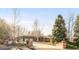 Charming brick home with manicured landscaping and a spacious driveway leading to a three-car garage at 103 Red Wing Ct, Mead, CO 80542