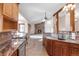 Well-appointed kitchen with granite countertops, stainless steel appliances, and an open view to the living room at 103 Red Wing Ct, Mead, CO 80542