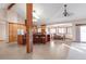 Open concept kitchen with an island, tile flooring, and an adjacent dining area at 103 Red Wing Ct, Mead, CO 80542