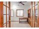Bright office space with built-in desk, storage, and stylish french doors at 103 Red Wing Ct, Mead, CO 80542