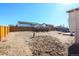 Large fenced backyard with fresh dirt and wood fence at 1104 S Biscay St, Aurora, CO 80017