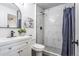 Updated bathroom features a modern vanity, updated shower, and sleek fixtures at 1104 S Biscay St, Aurora, CO 80017