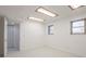 Clean bedroom with white walls, tile floors, two windows, closet and recessed lighting at 1104 S Biscay St, Aurora, CO 80017