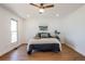 Bright bedroom with wood floors and large window overlooking the scenic landscape at 1104 S Biscay St, Aurora, CO 80017