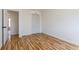Cozy bedroom with wood floors and bi-fold closet doors at 1104 S Biscay St, Aurora, CO 80017