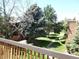 A view of the community green space with mature landscaping seen from a balcony at 2215 S Buckley Rd # 201, Aurora, CO 80013