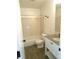 Bright bathroom featuring a shower and sink with granite counters at 2215 S Buckley Rd # 201, Aurora, CO 80013