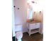 Bathroom with granite vanity and wood look flooring at 2215 S Buckley Rd # 201, Aurora, CO 80013