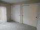 Bright bedroom featuring two large closets for ample storage space at 2215 S Buckley Rd # 201, Aurora, CO 80013