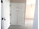 Hallway view showing a door and closet space with carpeted floor at 2215 S Buckley Rd # 201, Aurora, CO 80013