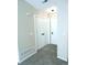 Neutral hallway features plush carpet flooring, a closet, and a ceiling light at 2215 S Buckley Rd # 201, Aurora, CO 80013
