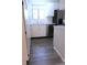 This is a kitchen with white cabinets, stainless steel appliances, and light countertops at 2215 S Buckley Rd # 201, Aurora, CO 80013