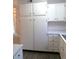 Spacious kitchen with white cabinets, new countertops, and hardwood-style vinyl flooring at 2215 S Buckley Rd # 201, Aurora, CO 80013