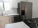 Bright kitchen with stainless steel appliances, white cabinets, stylish subway tile backsplash, and new countertops at 2215 S Buckley Rd # 201, Aurora, CO 80013