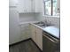 Updated kitchen with stainless steel dishwasher, subway tile backsplash, and countertops at 2215 S Buckley Rd # 201, Aurora, CO 80013