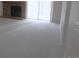 Bright living room featuring neutral carpeting, a brick fireplace, and sliding glass doors at 2215 S Buckley Rd # 201, Aurora, CO 80013