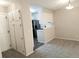 Neutral living space with carpet flooring and an open view of the adjacent kitchen at 2215 S Buckley Rd # 201, Aurora, CO 80013