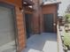Cozy outdoor patio with wood siding, a sliding glass door, and a storage closet at 2215 S Buckley Rd # 201, Aurora, CO 80013