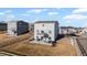 Backyard featuring well-maintained lawn and views of the surrounding neighborhood, patio with sitting and dining furniture at 4548 River Highlands Loop, Elizabeth, CO 80107