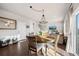 Dining room featuring a round table, stylish chairs, and a view into the adjacent living area at 4548 River Highlands Loop, Elizabeth, CO 80107