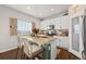 Well-appointed kitchen featuring stainless steel appliances, a granite island, and stylish bar stool seating at 4548 River Highlands Loop, Elizabeth, CO 80107