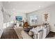 Inviting living room with a cozy sectional, decorative accents, and a mounted television for entertainment at 4548 River Highlands Loop, Elizabeth, CO 80107