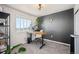 Modern home office with a wooden desk, great natural light, and decor at 4548 River Highlands Loop, Elizabeth, CO 80107