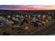 Panoramic aerial view of a neighborhood featuring a community pool, basketball court, and scenic views at 21028 E Saratoga Ave, Aurora, CO 80015