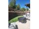 Charming backyard featuring a patio, lawn, and terraced landscaping, with cozy patio furniture at 21028 E Saratoga Ave, Aurora, CO 80015