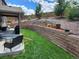 Nice backyard with terraced garden beds, patio, and lawn, perfect for outdoor living at 21028 E Saratoga Ave, Aurora, CO 80015