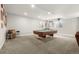 Finished basement featuring a pool table, bar stools and classic decor at 21028 E Saratoga Ave, Aurora, CO 80015
