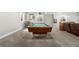 Basement with a pool table, stylish bar stools, and a well-lit atmosphere at 21028 E Saratoga Ave, Aurora, CO 80015