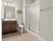 Bathroom featuring a vanity, shower, and ample lighting for a bright feel at 21028 E Saratoga Ave, Aurora, CO 80015