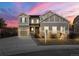 Charming two-story home with a well-manicured lawn at 21028 E Saratoga Ave, Aurora, CO 80015
