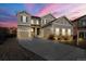 Beautiful two-story home with a long driveway and well-manicured lawn at 21028 E Saratoga Ave, Aurora, CO 80015