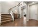 Spacious foyer with hardwood floors and a staircase at 21028 E Saratoga Ave, Aurora, CO 80015
