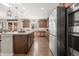 Spacious kitchen boasts stainless steel appliances, including double oven and a large refrigerator at 21028 E Saratoga Ave, Aurora, CO 80015