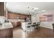 Well-lit kitchen featuring a center island with barstool seating and stainless steel appliances at 21028 E Saratoga Ave, Aurora, CO 80015