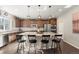 Kitchen featuring a center island with barstool seating and stainless steel appliances at 21028 E Saratoga Ave, Aurora, CO 80015