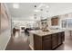 Spacious open concept kitchen area featuring center island with room for barstools at 21028 E Saratoga Ave, Aurora, CO 80015