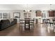 Open-concept living room with dining area and modern finishes at 21028 E Saratoga Ave, Aurora, CO 80015