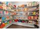 Well-stocked walk-in pantry offers ample storage with shelving and various food items at 21028 E Saratoga Ave, Aurora, CO 80015