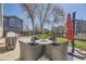Backyard patio area with outdoor seating and BBQ grill, ideal for entertaining at 4708 Rock Pipit Ct, Highlands Ranch, CO 80126