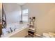 Soaking tub and shelving is an attraction of this bathroom at 4708 Rock Pipit Ct, Highlands Ranch, CO 80126