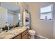 Well-lit bathroom with granite countertop, modern fixtures, and ample storage space at 4708 Rock Pipit Ct, Highlands Ranch, CO 80126