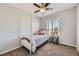 Cozy bedroom with a four-poster bed, window view, and charming decor at 4708 Rock Pipit Ct, Highlands Ranch, CO 80126